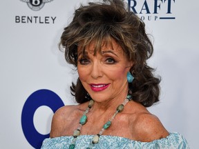 British actress Joan Collins poses on the red carpet upon her arrival for the midsummer party for Elthon John AIDS Foundation, in Cap d'Antibes, near Antibes, southern France, on July 24, 2019.