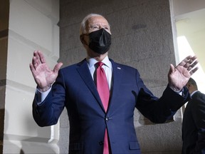 U.S. President Joe Biden talks to the media as he leaves a House Democratic caucus meeting at the U.S. Capitol on Oct. 1, 2021 in Washington, D.C.