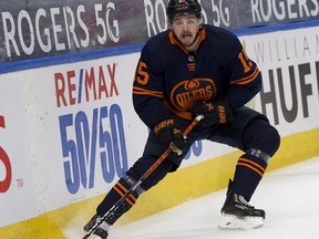 Edmonton Oilers Josh Archibald skates for the puck against the Calgary Flames during first period NHL action on Saturday, May 1, 2021 in Edmonton.