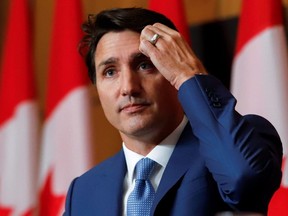 Prime Minister Justin Trudeau listens to question during a news conference in Ottawa, Wednesday, Oct. 6, 2021.