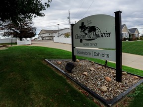 A sign marks the entrance of the home office of Christian Aid Ministries in Millersburg, Ohio, Oct. 17, 2021.