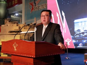 North Korea's leader Kim Jong Un speaks at the Defence Development Exhibition, in Pyongyang, North Korea, in this undated photo released on Tuesday, Oct. 12, 2021 by North Korea's Korean Central News Agency.