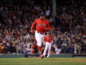 Kyle Schwarber of the Boston Red Sox rounds the bases after he hit a grand slam home run against the Houston Astros in the second inning of Game 3 of the American League Championship Series at Fenway Park on Oct. 18, 2021 in Boston.