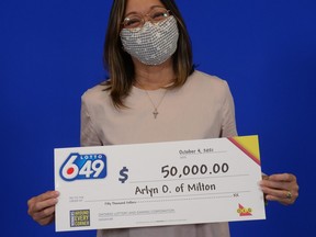 Milton's Arlyn Ocampo, 55, with her Lotto 6/49 winnings.