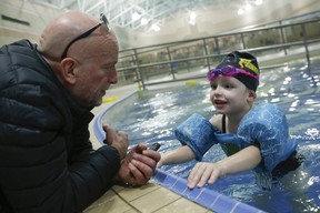 Mike Strobel and mighty mite Madi Ambos at Variety Village. JACK BOLAND/TORONTO SUN FILES