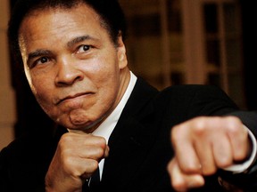 Muhammad Ali poses during the Crystal Award ceremony at the World Economic Forum (WEF) in Davos, Switzerland, in this January 28, 2006 photo.