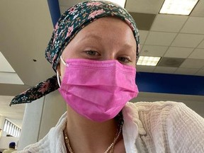 Actress Miranda McKeon wearing mask and wrap on her head.