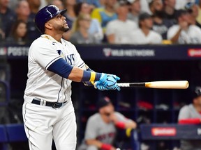 Nelson Cruz of the Tampa Bay Rays hits a solo home run against the Boston Red Sox during Game 1 of the American League Division Series at Tropicana Field on October 7, 2021 in St Petersburg, Florida.