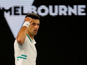 Novak Djokovic reacts during his final match against Daniil Medvedev at the Australian Open, in Melbourne, Feb. 21, 2021.