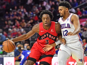 Raptors forward OG Anunoby (left) is defended by Philadelphia 76ers' Tobias Harris during the second quarter at Wells Fargo Center on Oct. 7, 2021.
