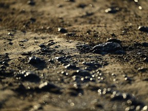 Oil is seen on the beach in Huntington Beach, California on Oct. 3, 2021, after a pipeline breach connected to an oil rig off shore started leaking oil, according to an Orange County Supervisor.