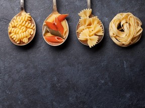 Various pasta on spoons