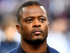 In this file photo taken on Nov. 11, 2016, France's defender Patrice Evra stands prior to the 2018 World Cup group A qualifying football match between France and Sweden at the Stade de France in Saint-Denis, north of Paris.