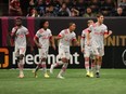 Jordan Perruzza (right) celebrates his first goal with his Reds teammates in Atlanta on Saturday.  Jasen Vinlove/USA TODAY Sports