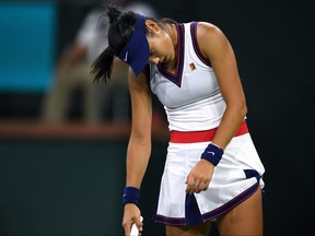 Emma Raducanu reacts after losing a point to Aliaksandra Sasnovich at Indian Wells Tennis Garden in Calif., Oct. 8, 2021.