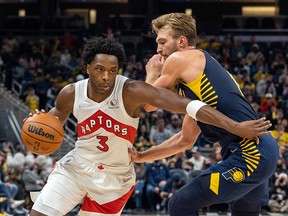 Toronto Raptors forward OG Anunoby (3) dribbles the ball while Indiana Pacers forward Domantas Sabonis (11) defends at Gainbridge Fieldhouse.