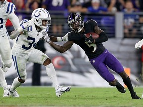 Marquise Brown of the Baltimore Ravens is defended by Isaiah Rodgers of the Indianapolis Colts at M&T Bank Stadium on October 11, 2021 in Baltimore.