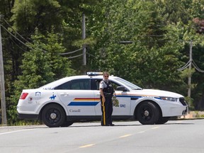 Members of the RCMP control the scene where a man was shot on Friday night, near Miramichi, N.B. on Saturday, June 13, 2020.