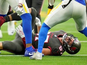 Tampa Bay Buccaneers tight end Rob Gronkowski grimaces after getting hit by Los Angeles Rams linebacker Terrell Lewis during the third quarter at SoFi Stadium in Inglewood, Calif., Sept. 26, 2021.
