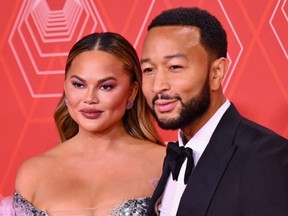 John Legend and Chrissy Teigen attend the 74th Annual Tony Awards at the Winter Garden Theater in New York City, Sept. 26, 2021.