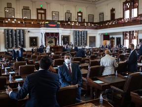 Texas state representatives gather in the House chamber before the start of the 87th Legislature's third special session at the State Capitol on September 20, 2021 in Austin, Texas.