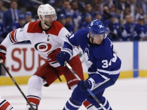 Maple Leafs' Auston Matthews with Carolina Hurricanes' Jordan Staal at the Air Canada Centre in Toronto on October 22, 2017.