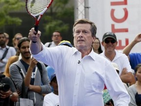 Mayor John Tory is pictured on July 21, 2016 when he faced Canadian tennis player Milos Raonic in a friendly match at Nathan Phillips Square as part of the lead up to the Rogers Cup 2016.