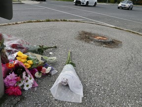 Flowers left at the scene at the corner of Birchmount and Danforth Aves. on Wednesday, October 20, 2021, the day after a 17-year-old girl was killed crossing the street.