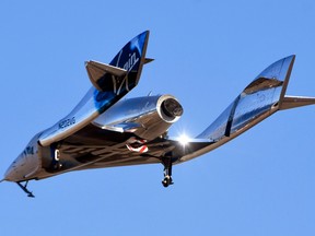Virgin Galactic’s space tourism rocket plane SpaceShipTwo returns after a test flight  from Mojave Air and Space Port in Mojave, California, December 13, 2018.