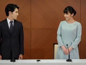 Japan's Princess Mako and her husband Kei Komuro attend a news conference to announce their wedding at Grand Arc Hotel in Tokyo, Japan, October 26, 2021.