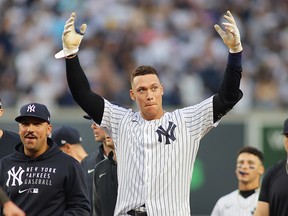 Aaron Judge of the New York Yankees celebrates after hitting a walk-off single in the bottom of the ninth inning to beat the Tampa Bay Rays 1-0 at Yankee Stadium on October 03, 2021 in New York.