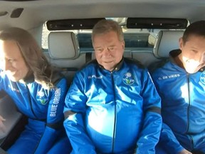 In this still image taken from a Blue Origin video, New Shepard NS-18 mission crew members (L-R) Blue Origins Vice President of Mission & Flight Operations, Audrey Powers; “Star Trek” actor, William Shatner and Medidata Solutions Co-Founder, Glen de Vries, ride to the launch pad on Oct. 13, 2021.