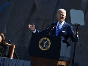 US President Joe Biden, with Vice President Kamala Harris, speaks at a ceremony marking the 10th Anniversary dedication of the Martin Luther King, Jr., Memorial, in Washington, DC, on October 21, 2021.