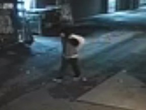 Investigators need help identifying a man who lit mattresses on fire in a laneway near Richmond St. W. and Portland St. on Wednesday, Oct. 27, 2021.