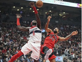 Washington Wizards center Montrezl Harrell (6) and Toronto Raptors center Khem Birch (24) fight for a rebound during the first half at Scotiabank Arena.