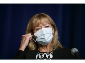 Ontario Minister of Health Christine Elliott removes her mask to speak at a press conference at Queen's Park in Toronto, Wednesday, Sept. 22, 2021.