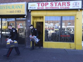 Toronto Police investigate after a man was injured in a shooting at Top Star's music recording studio on Eglinton Ave. W., east of Oakwood Ave., on Sunday, Oct. 24, 2021.