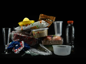 This illustration shows plastic containers, plastic cutlery and plastic-wrapped food packaging containing phthalates, a group of chemicals used by major fast-food brands in products from food-handling gloves to processing equipment, such as industrial tubing and conveyors. A new study says these leach into the food we order at restaurants.