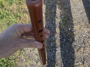 A flute that a man was playing with driving in Burlington, according to police.