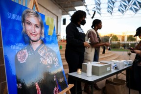 An image of cinematographer Halyna Hutchins, who died after being shot by Alec Baldwin on the set of his movie “Rust”, is displayed at a vigil in her honour in Albuquerque, New Mexico, Saturday, Oct. 23, 2021.