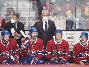 Montreal Canadiens head coach Doninique Ducharme, centre, looks on from the bench during first period NHL hockey action against the New York Rangers in Montreal, Saturday, October 16, 2021.