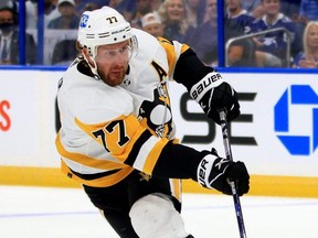 Penguins forward Jeff Carter takes a shot during the first period of a game against the Lightning at Amalie Arena in Tampa, Fla., Oct. 12, 2021.