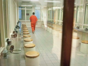 An inmate walks through the visitation area at the Elgin Middlesex Detention Centre in London. FILE PHOTO