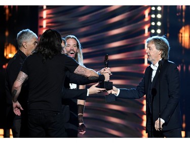 Paul McCartney inducts Foo Fighters into the Rock and Roll Hall of Fame, in Cleveland, Ohio, U.S. Oct. 30, 2021.