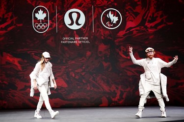 Athletes reveal the Lululemon Athletica's Team Canada uniforms for the Beijing 2022 Winter Olympics, in Toronto, Tuesday, Oct. 26, 2021.