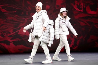 Athletes reveal the Lululemon Athletica's Team Canada uniforms for the Beijing 2022 Winter Olympics, in Toronto, Tuesday, Oct. 26, 2021.