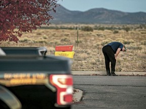A distraught Alec Baldwin lingers in the parking lot outside the Santa Fe County Sheriff's Office in Santa Fe, N.M., after he was questioned about a shooting on the set of the film "Rust" on the outskirts of Santa Fe, Thursday, Oct. 21, 2021.