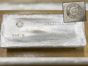 A silver ingot stolen in an $11-million heist in Montreal. Inset: smelter proof mark on the stolen silver