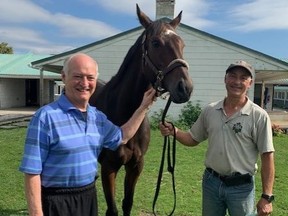 Jerry Howarth (left) and trainer John LeBlanc Jr. at the Woodbine backstretch this week.