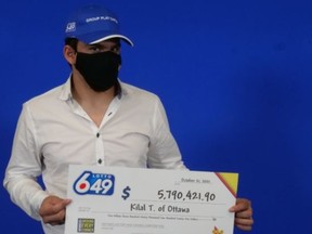 Kilal Taha, 21, of Ottawa, with his big cheque.